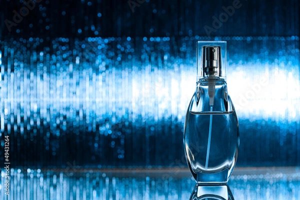 Obraz Perfume on blue background