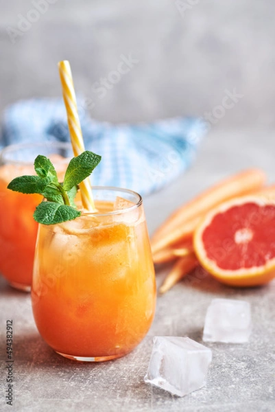 Obraz Carrot juice served in glass. Fresh carrot juice served in glass on table. Carrot healthy juice for detox.