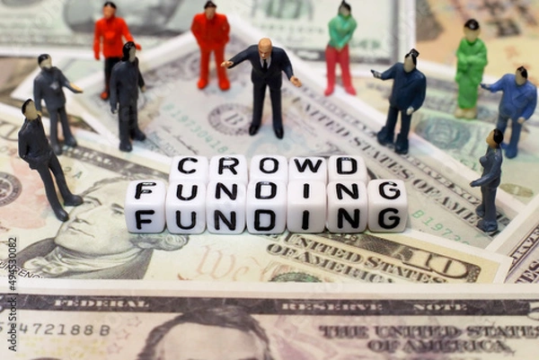 Fototapeta crowd of people and letter cube on dollar background. conceptual image of crowd funding for start-up business, raised fund or donation.