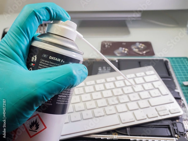 Obraz Man's hand with compressed air spray. Selective focus.