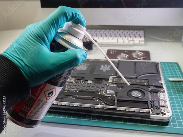 Obraz Hand with compressed air spray. Selective focus.