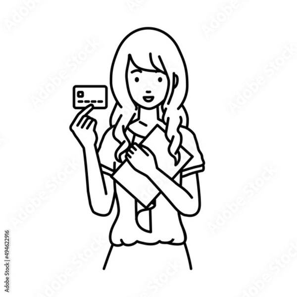 Fototapeta 立って書類とカードを手に持つオフィスカジュアルの女性