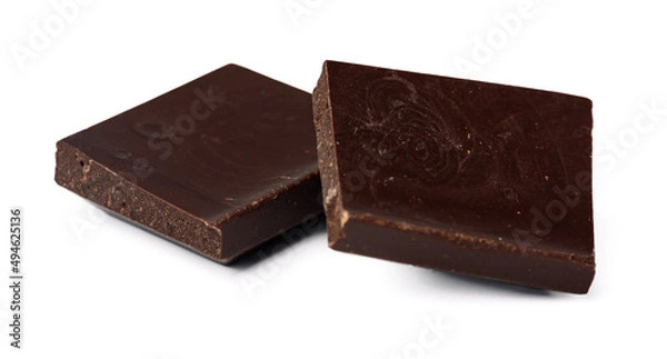 Fototapeta Small dark chocolate pieces isolated on white background