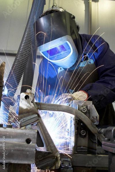Fototapeta Welder welding with acetylene arc