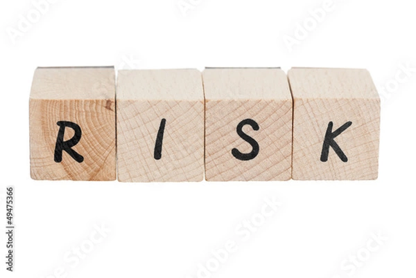 Obraz Ryzyko pisane drewnianymi klockami.