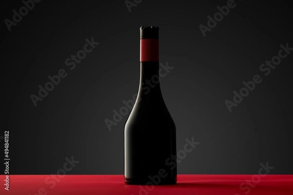 Fototapeta Illuminated alcohol bottle silhouette on red table and black background.