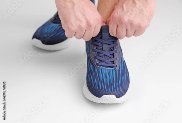 Obraz Sport shoes for running on white background closeup