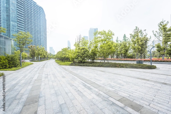 Fototapeta Urban modern commercial buildings and space platforms - background pictures of automobile advertisements