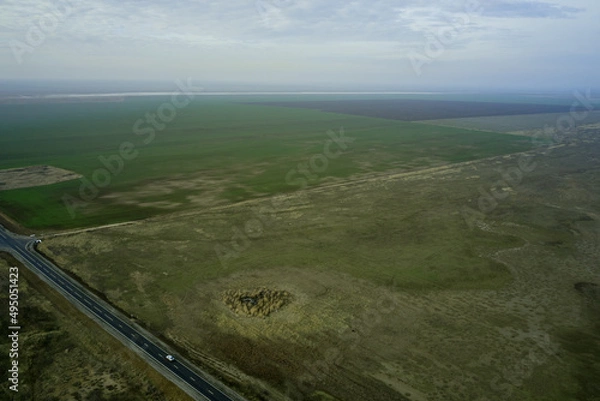 Obraz steppe landscape with expensive arable land and clouds