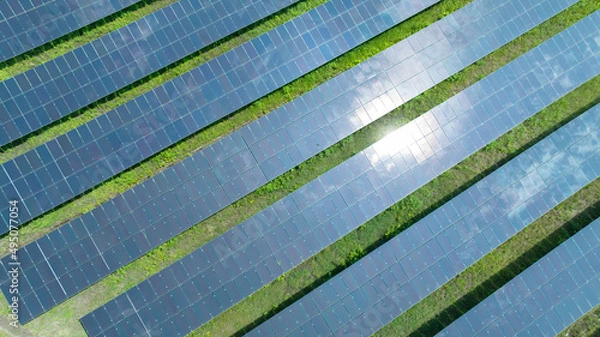 Fototapeta Aerial top view of solar panels or solar cells farm, renewable energy source. Ecotechnology for electric power in the industry.