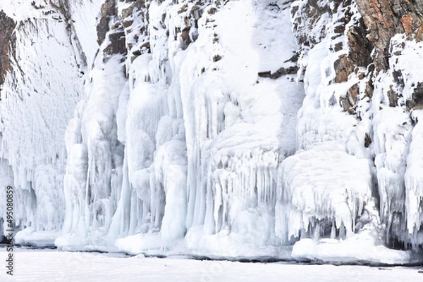 Fototapeta Frozen splash water on Baikal lake. Abstract winter background. Amazing scenery with frozen water