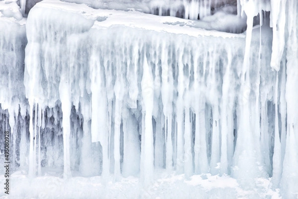 Fototapeta Frozen splash water on Baikal lake. Abstract winter background. Amazing scenery with frozen water