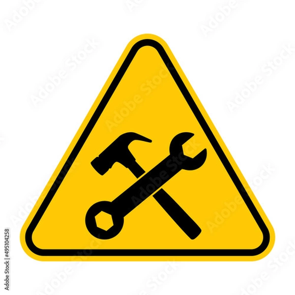 Fototapeta Under construction sign. Vector illustration of yellow triangle warning sign with crossed hammer and wrench icon inside. Construction site caution symbol. Risk of accident.