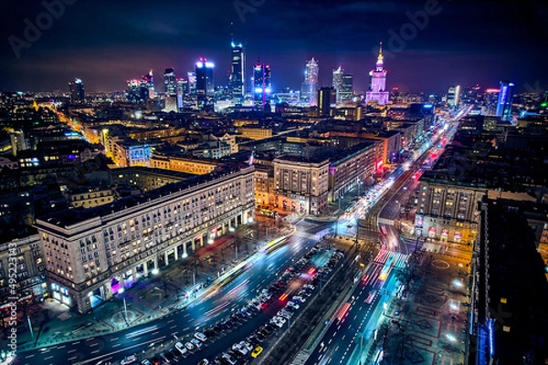 Obraz Constitution Square (PL: Plac Konstytucji) - a view of the center of night Warsaw with skyscrapers in the background - the lights of the big city by night, Poland, EU