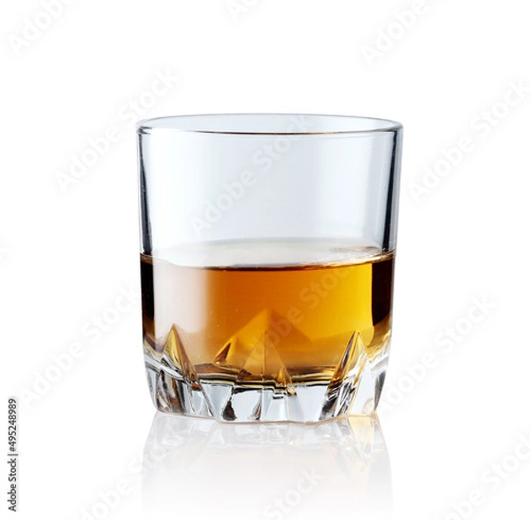 Fototapeta Scotch whiskey in an elegant glass on a white background with reflections.