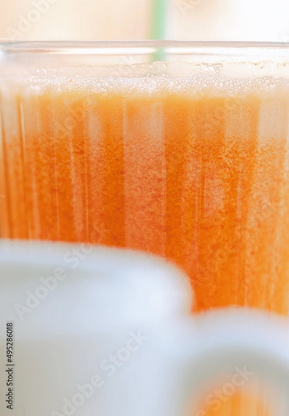 Fototapeta Scrambled eggs with bacon avocado and orange juice