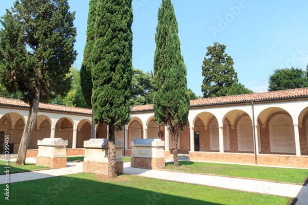 Obraz Cloistered courtyard of monastery with tombs next to church Chiesa di San Francesco in Treviso, Italy