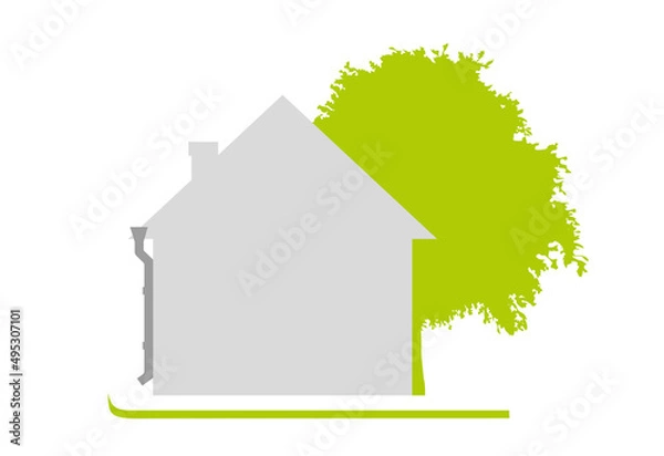 Fototapeta House on a green lawn next to a tree. A flat one-color house, simple in shape. Sunny day. Isolated