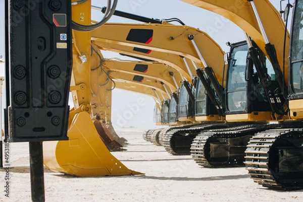 Fototapeta Dozer, excavator, and road rollers working on the mud site