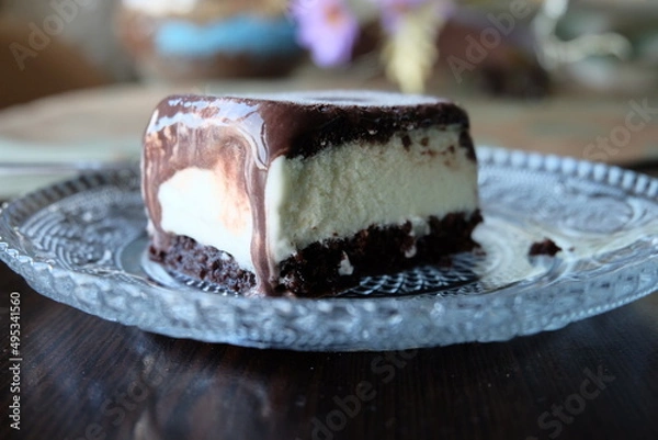 Fototapeta Dairy free ice cream in a container, selective focus. Pieces of ice cream cake with vanilla and cocoa. It is called "Dondurma" or "Dondurma Sandvic" in Turkish. Summer food.