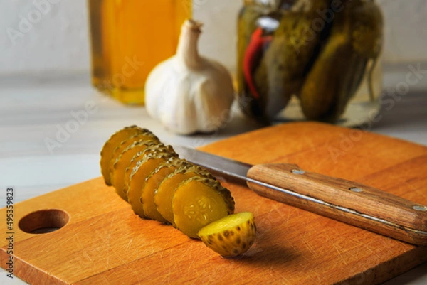Fototapeta Pickled cucumbers in a jar.