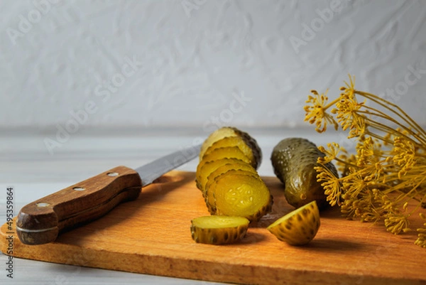 Fototapeta Pickled cucumbers in a jar.