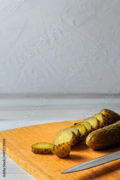 Fototapeta Pickled cucumbers in a jar.