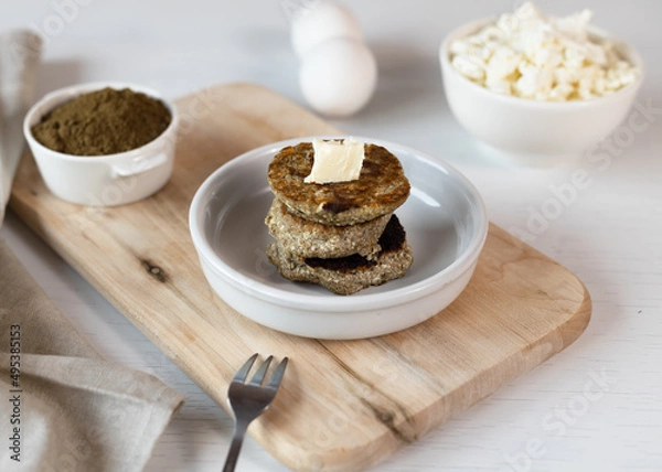 Fototapeta Syrniki, cottage cheese fritters or curd pancakes, made from curd and hemp flour. Low carb Ketogenic diet.