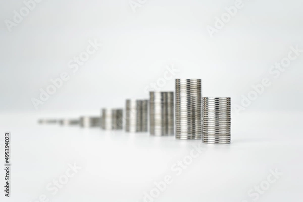 Fototapeta Coin Steps On White Background. Money Saving and Economy Concept