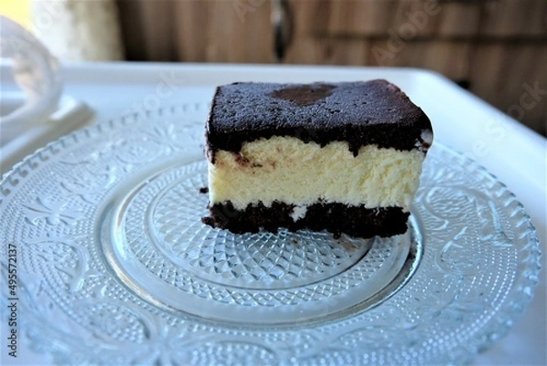 Fototapeta Dairy free ice cream in a container, selective focus. Pieces of ice cream cake with vanilla and cocoa. It is called "Dondurma" or "Dondurma Sandvic" in Turkish. Summer food.
