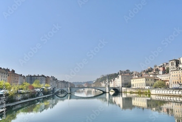 Fototapeta Beautiful city of lyon and its bonaparte bridge over the river Sâone on a spring morning