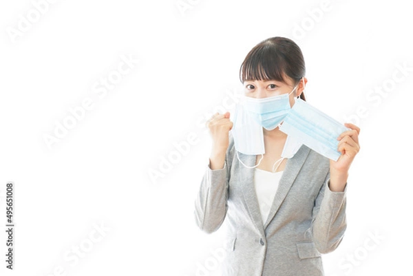 Fototapeta 大量のマスクを着けた若いビジネスパーソン