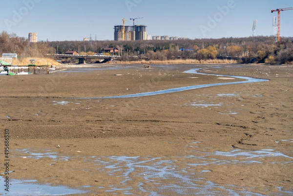 Obraz dried-up riverbed within city limits