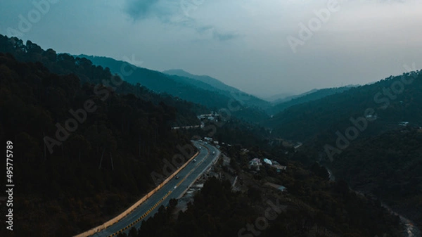 Obraz Aerial view of road in the middle of green mountains