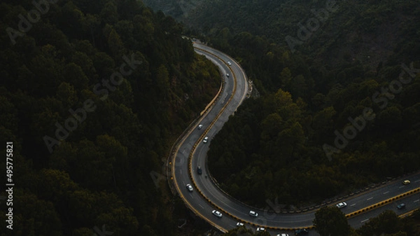 Obraz Aerial view of road in the middle of green mountains