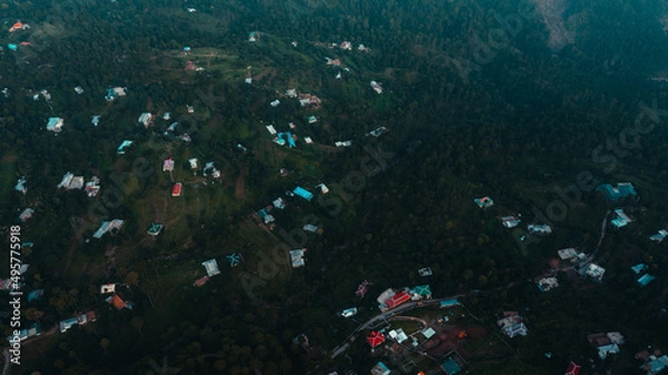 Obraz Aerial view of beautiful homes in green hills surrounded by trees 