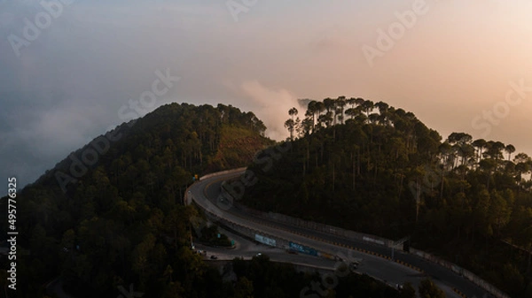 Obraz Aerial view of beautiful homes in green hills surrounded by trees 