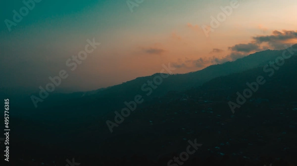 Obraz Silhouette of mountain under cloudy sky
