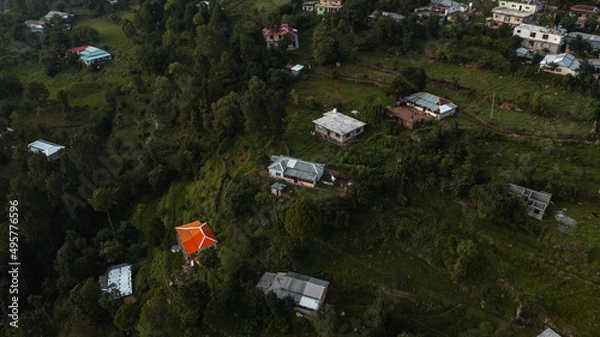 Obraz Aerial view of beautiful homes in green hills surrounded by trees 