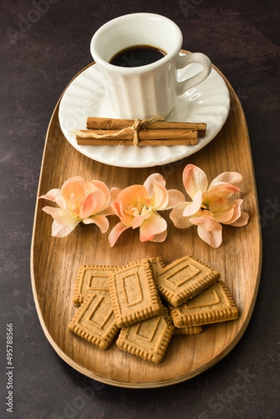 Fototapeta Coffee time with pastries on dark background