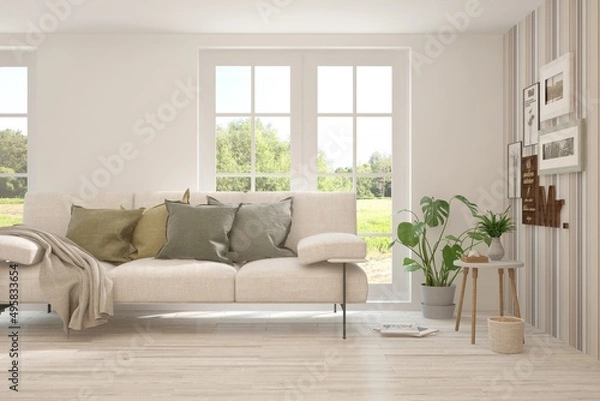 Fototapeta Stylish room in white color with sofa and summer landscape in window. Scandinavian interior design. 3D illustration