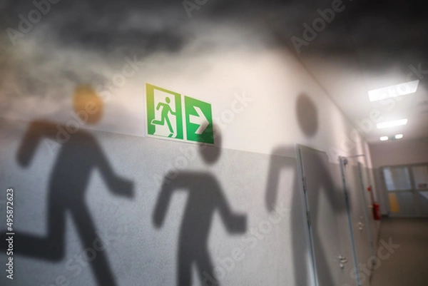Fototapeta fire in the building and running shadows of people