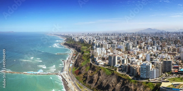 Fototapeta Aerial panorama of Lima, Peru along the coast also known as Circuito de Playas de la Costa Verde at a golden hour sunset