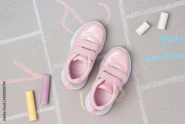 Obraz Pink sneakers and hopscotch game. Top view Flat lay