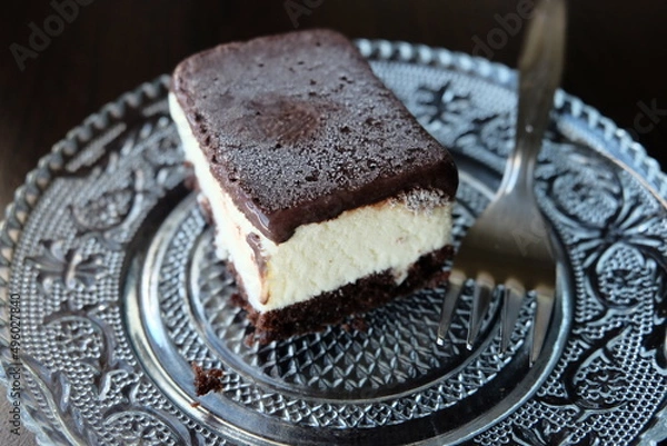 Fototapeta Dairy free ice cream in a container, selective focus. That is ice not grain. Pieces of ice cream cake with vanilla and cocoa. It is called "Dondurma" or "Dondurma Sandvic" in Turkish. Summer food.