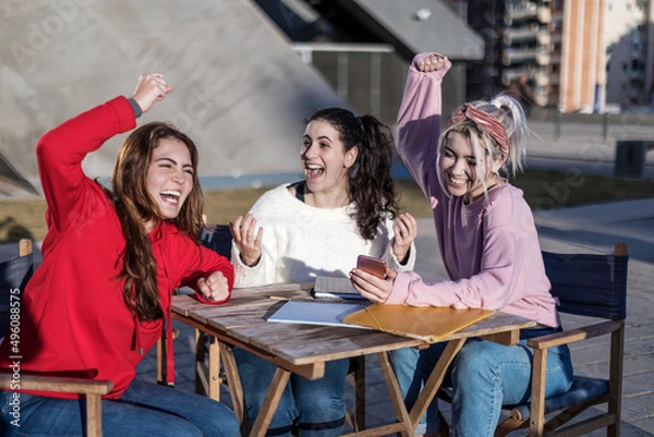 Obraz Overjoyed students celebrating successful final tests