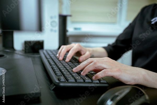 Fototapeta  Female hands or woman office worker typing on the keyboard