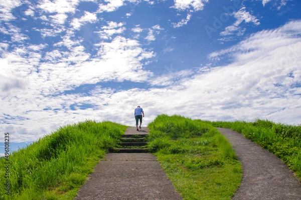 Obraz 丘を登る人