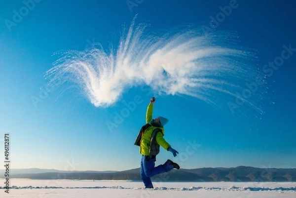 Fototapeta boiling water in the cold, happy woman on a walk in winter,
