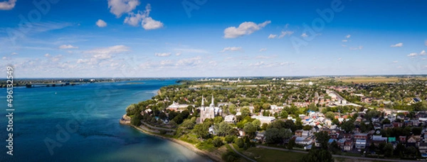 Fototapeta Aerial panoramic view of the city of Varennes and the St. Lawrence River.
